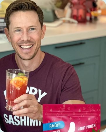 Bobby Parrish holds fruit punch made with hydration packets and electrolytes powder.